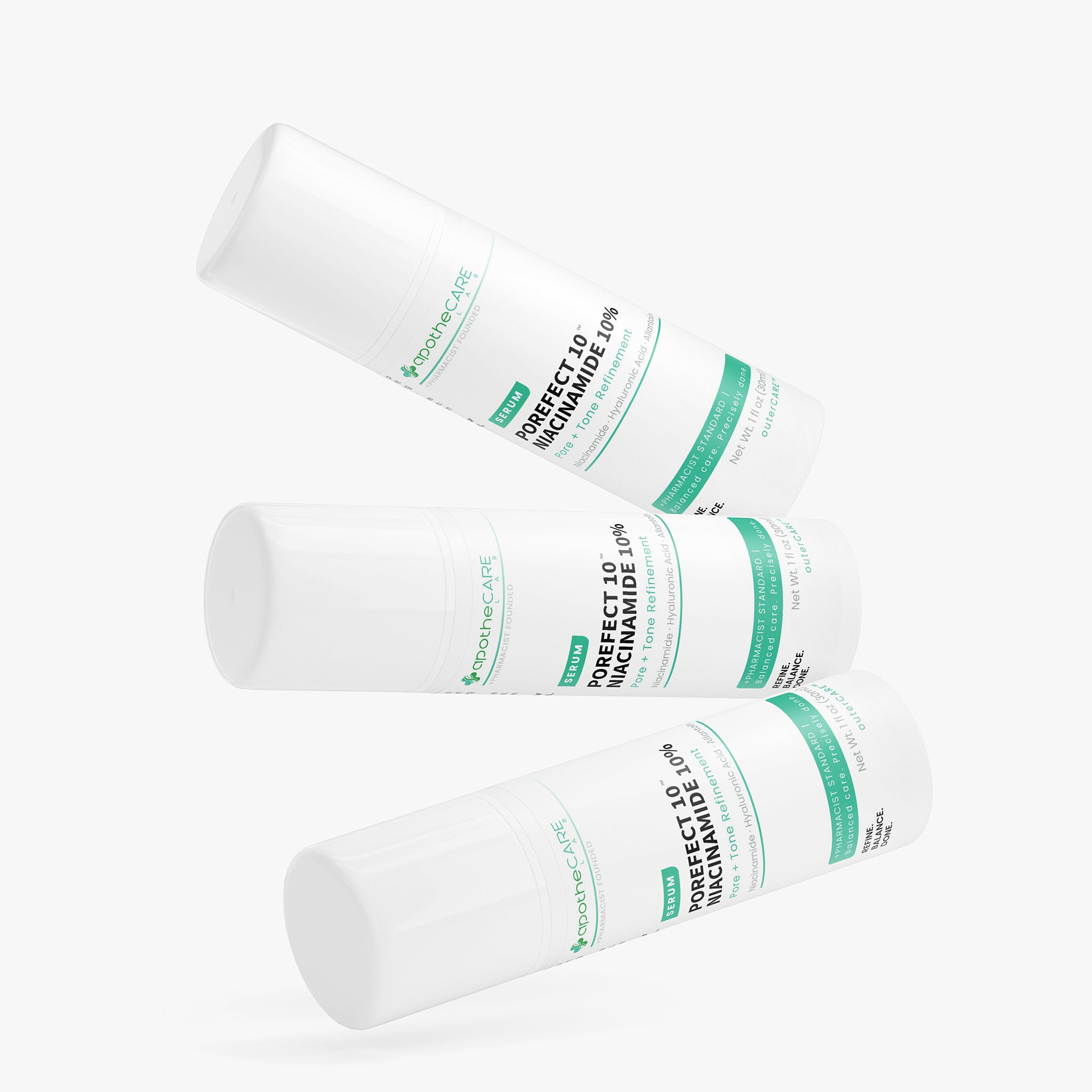 Three white cylindrical containers with green labels on a white background