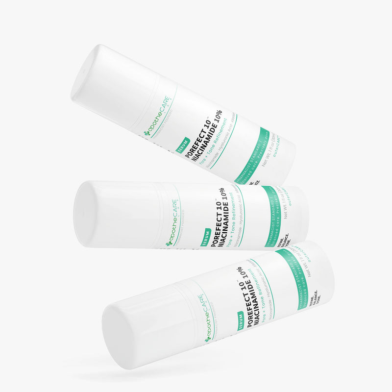 Three white cylindrical containers with green labels on a white background