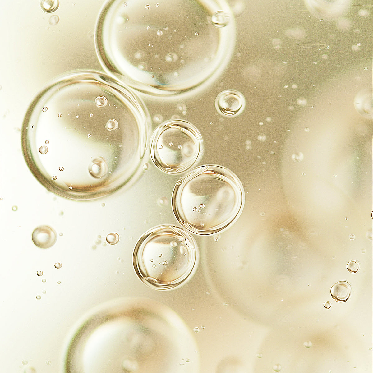 Close-up of golden bubbles on a light background