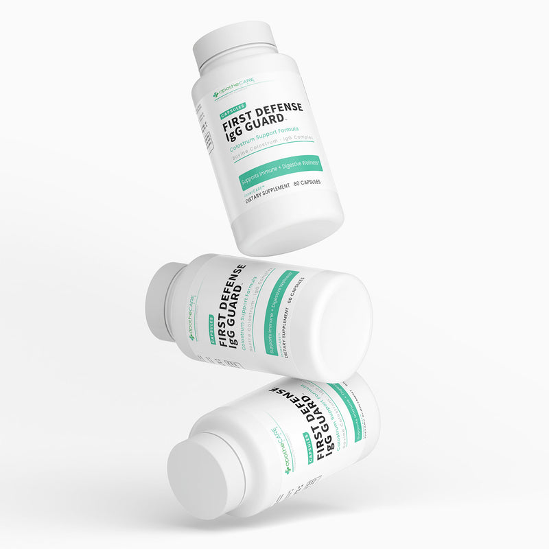 Three bottles of 'First Defense IgG Guard' on a white background
