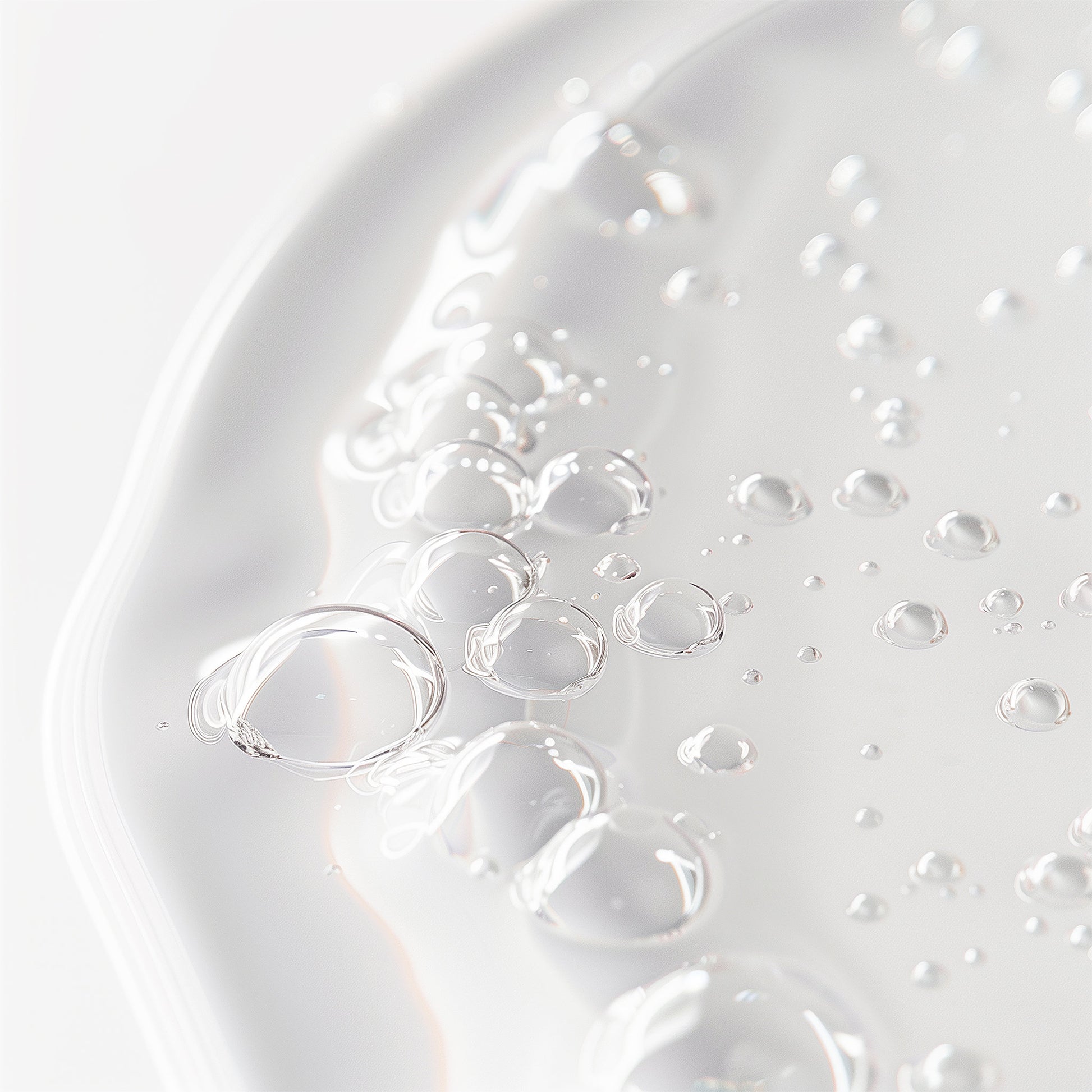 Close-up of clear bubbles on a white surface