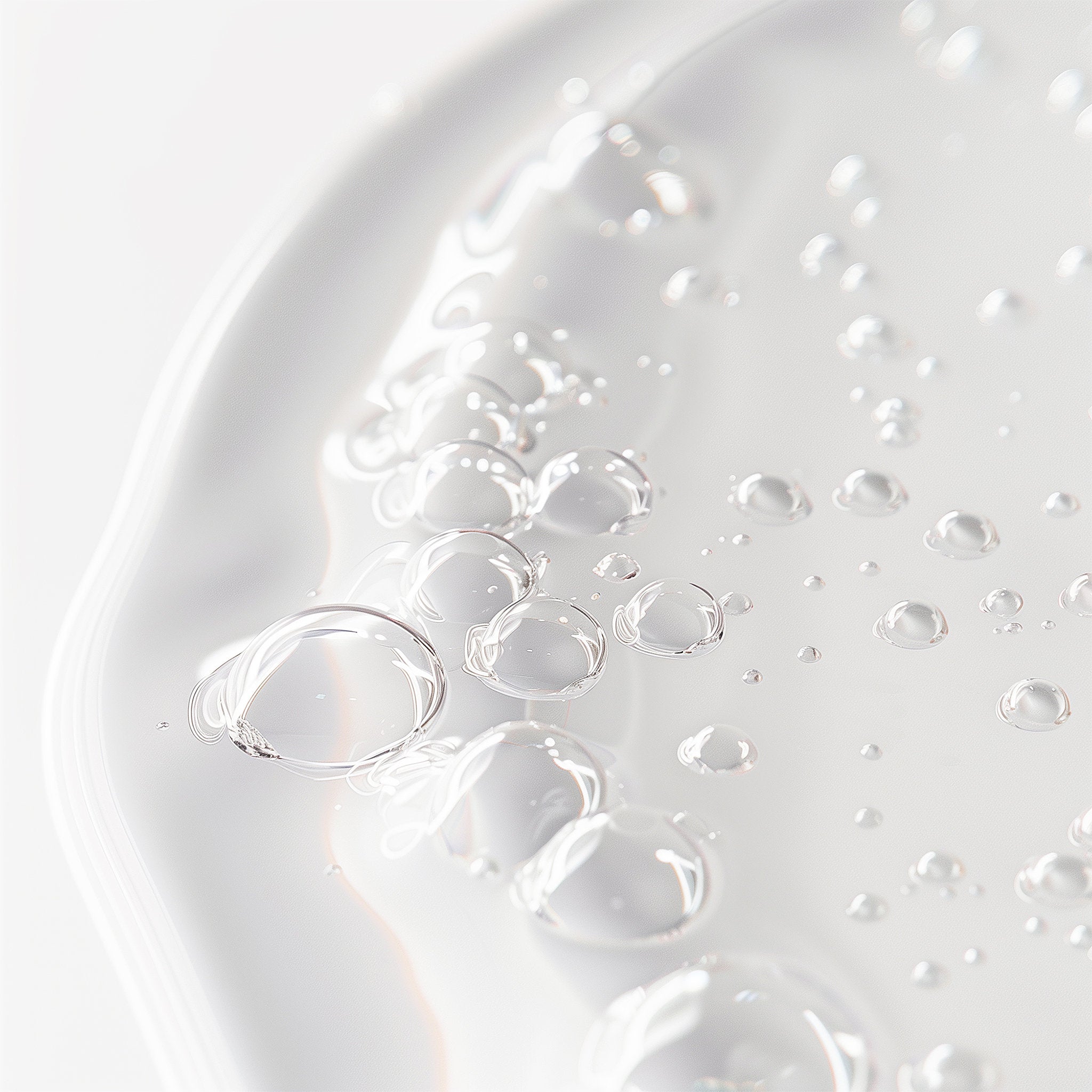 Close-up of clear bubbles on a white surface