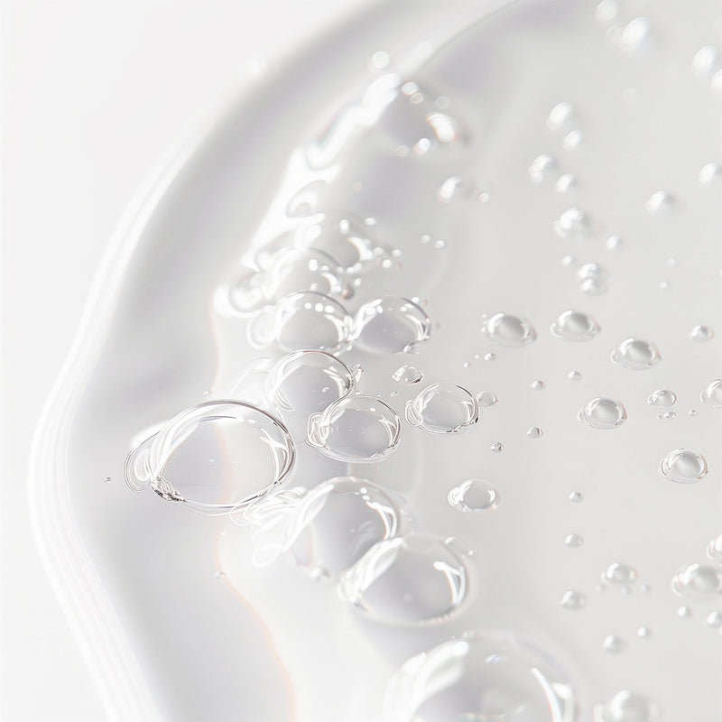 Close-up of clear bubbles on a white surface