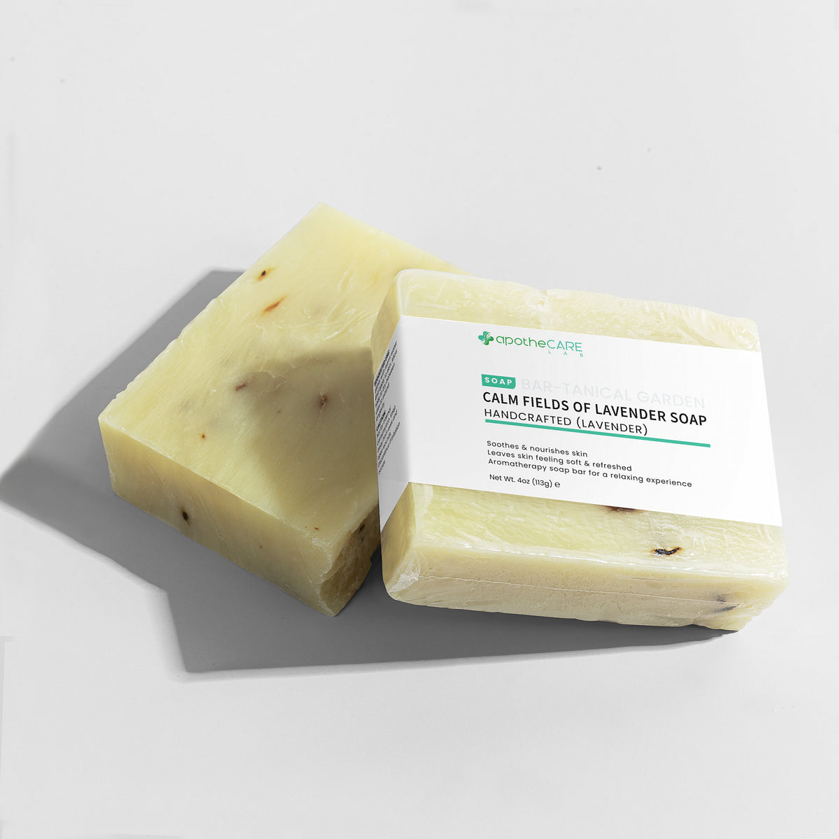 Two bars of soap with a label on a light gray background