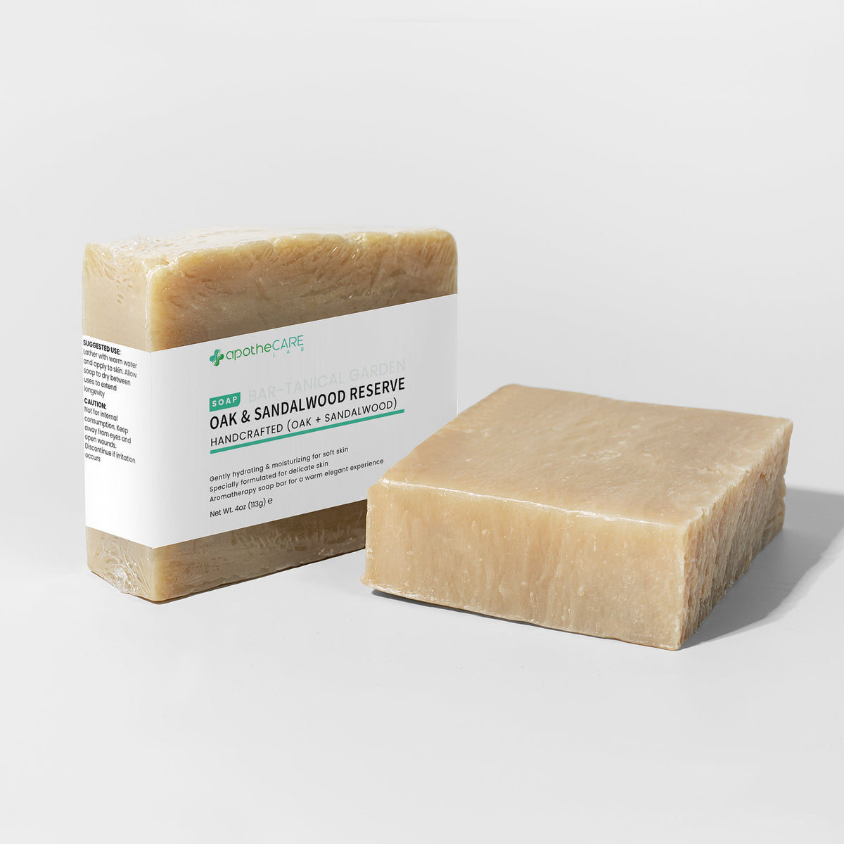 Two bars of soap, one with a label, on a light gray background