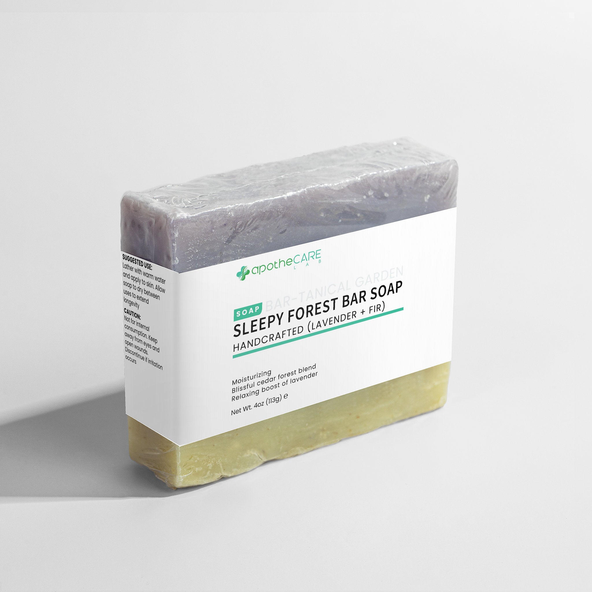 A bar of soap wrapped in clear plastic with a white label reading 'SLEEPY FOREST BAR SOAP' and the apotheCARE LAB brand name, photographed on a light gray background.