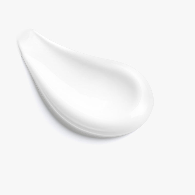 Dab of white cream spread on a white background