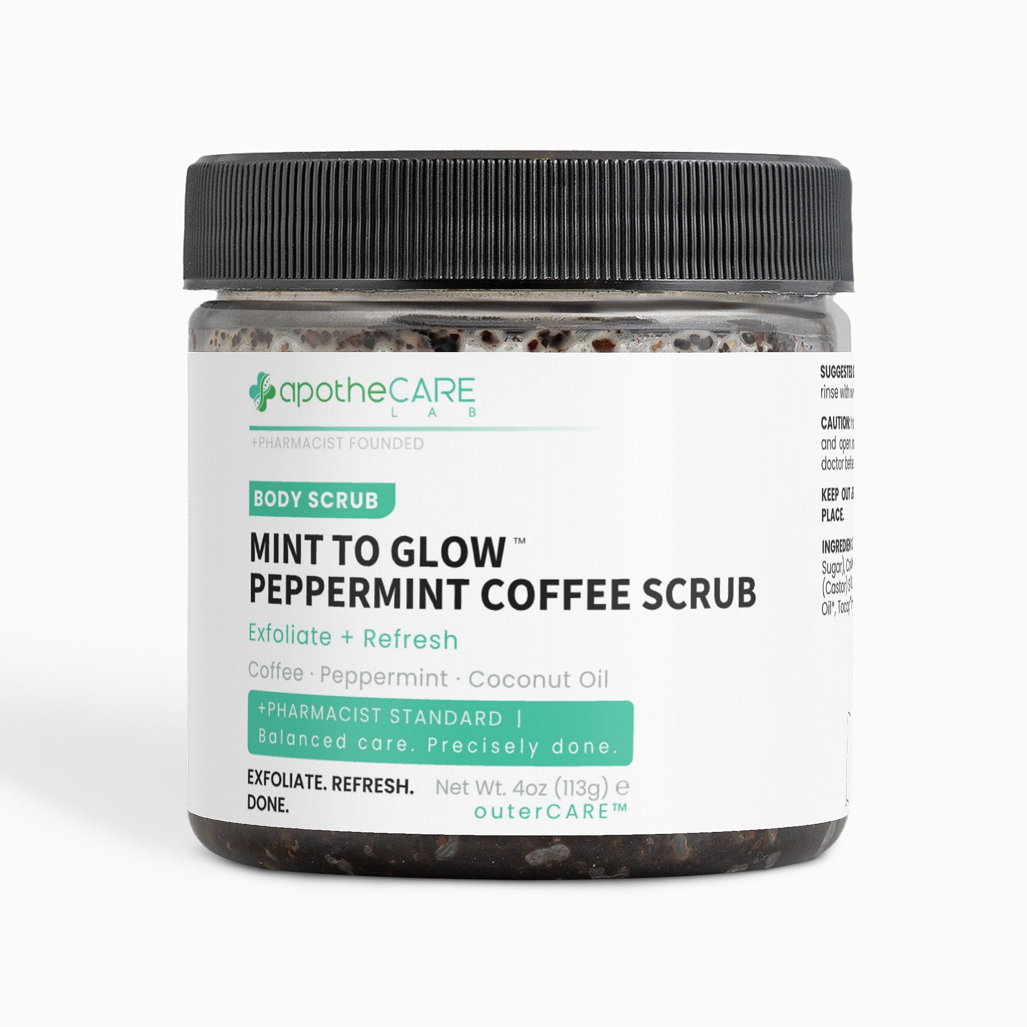 A jar of apotheCARE Lab Mint to Glow Peppermint Coffee Scrub with a black ribbed lid and a white label, set against a plain white background.