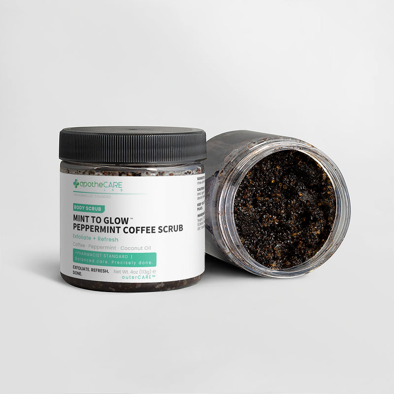 Two jars of apotheCARE LAB Mint to Glow Peppermint Coffee Scrub on a light gray background, with one jar open to show the dark scrub inside.