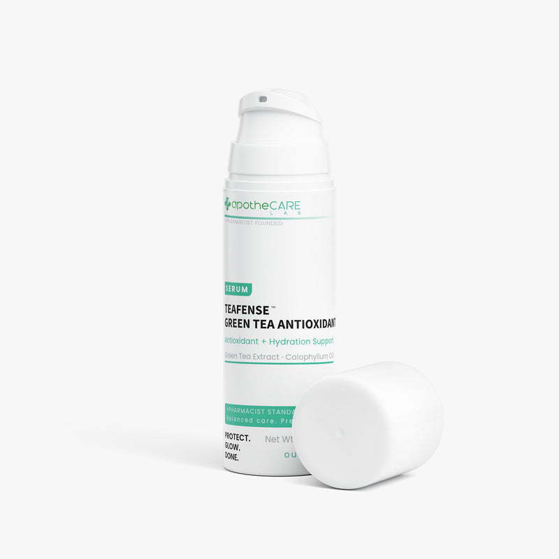 A white cylindrical serum bottle labeled Apothcare Teafense Green Tea Antioxidant, shown with its cap placed beside it on a clean white background.