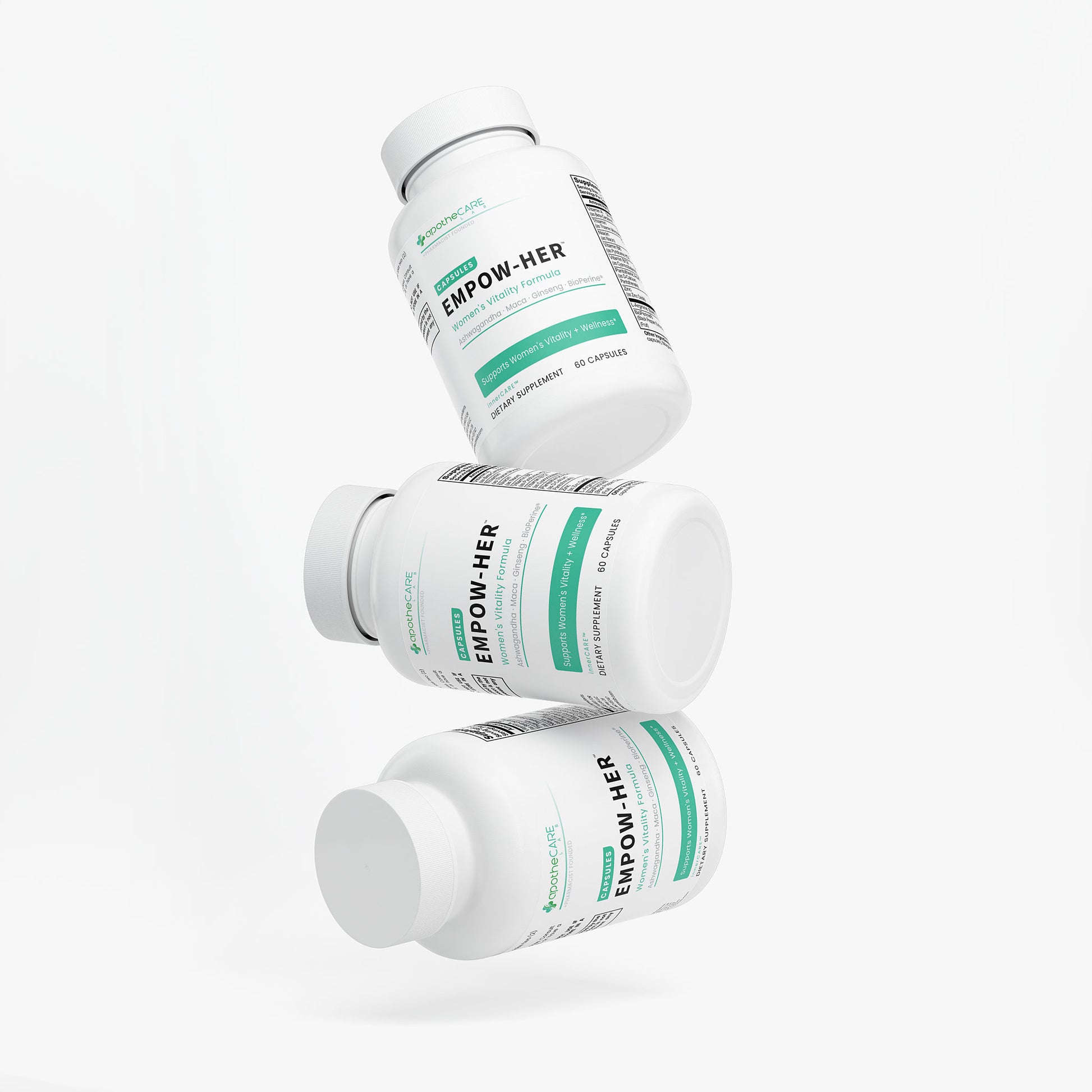 Three Women's Vitality Formula supplement bottles stacked on a white background