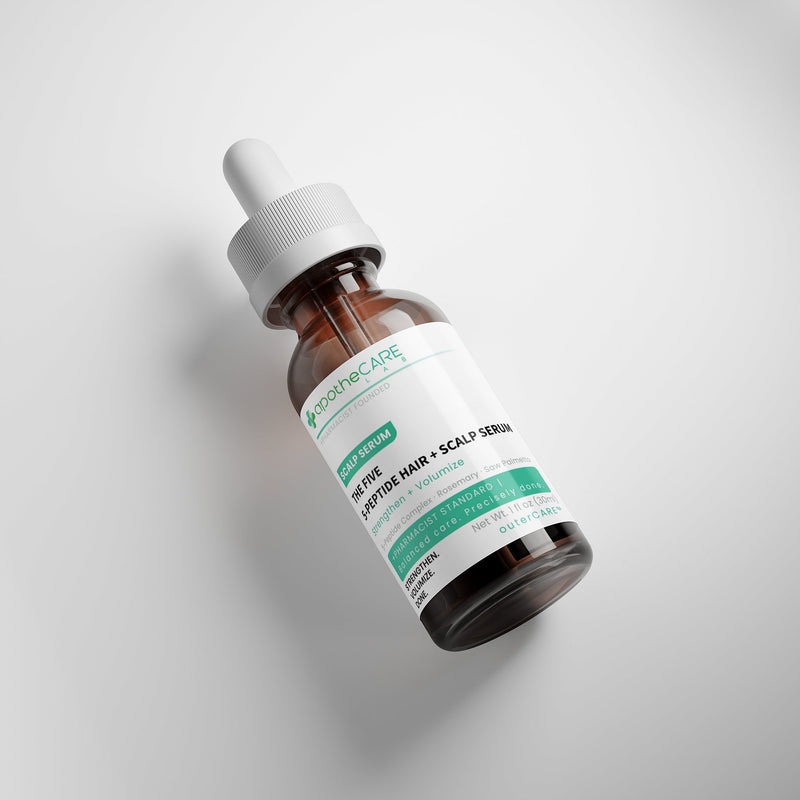 Bottle of peptide scalp serum on a light gray background