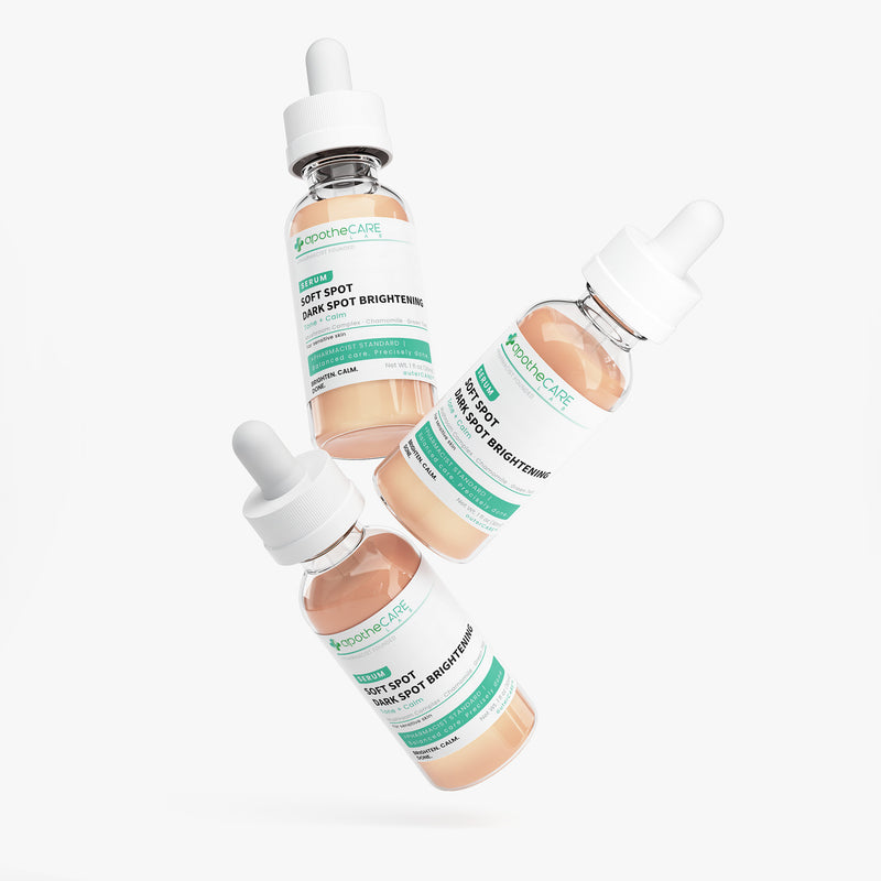 Three glass dropper bottles of apotheCARE LAG Soft Spot. Dark Spot Brightening serum floating diagonally against a clean white background.
