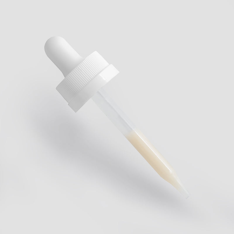 White dropper bottle on a light gray background