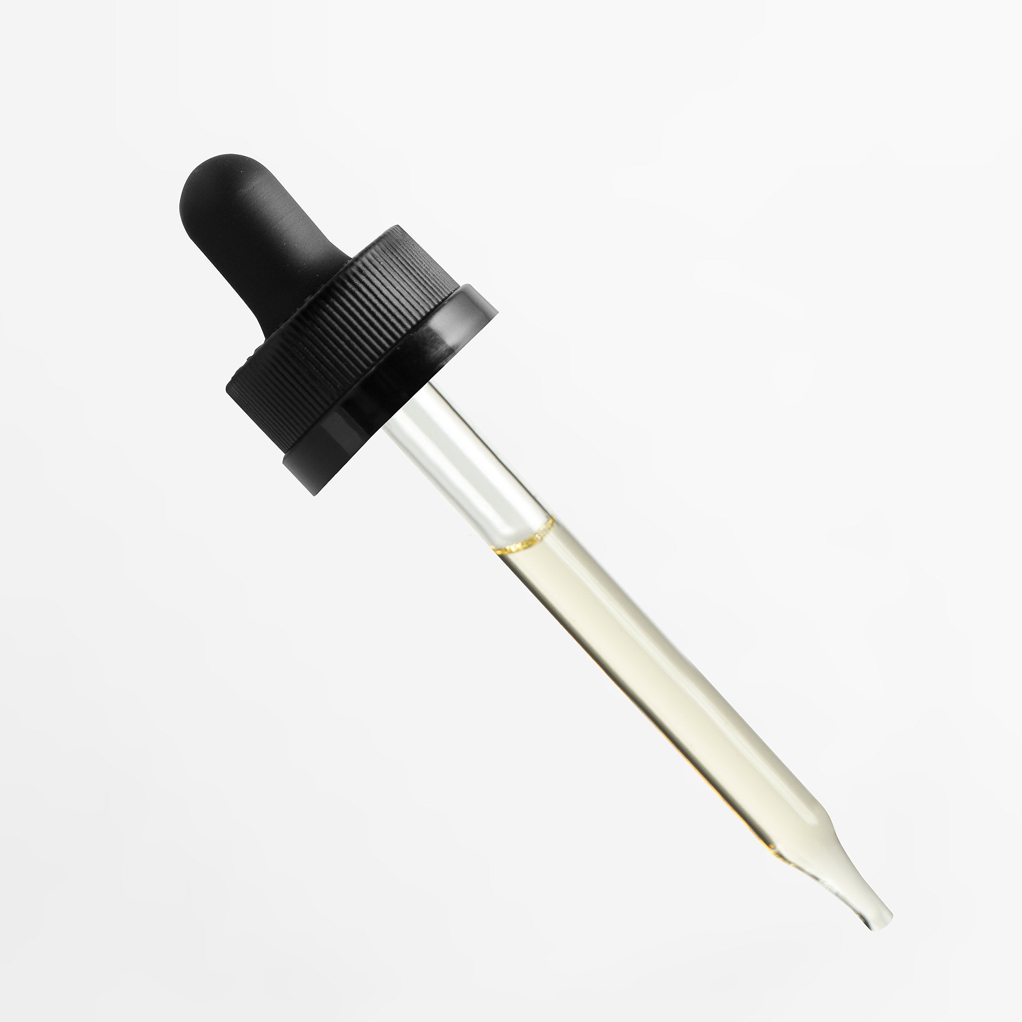 Dropper bottle with black cap and clear glass container on a white background