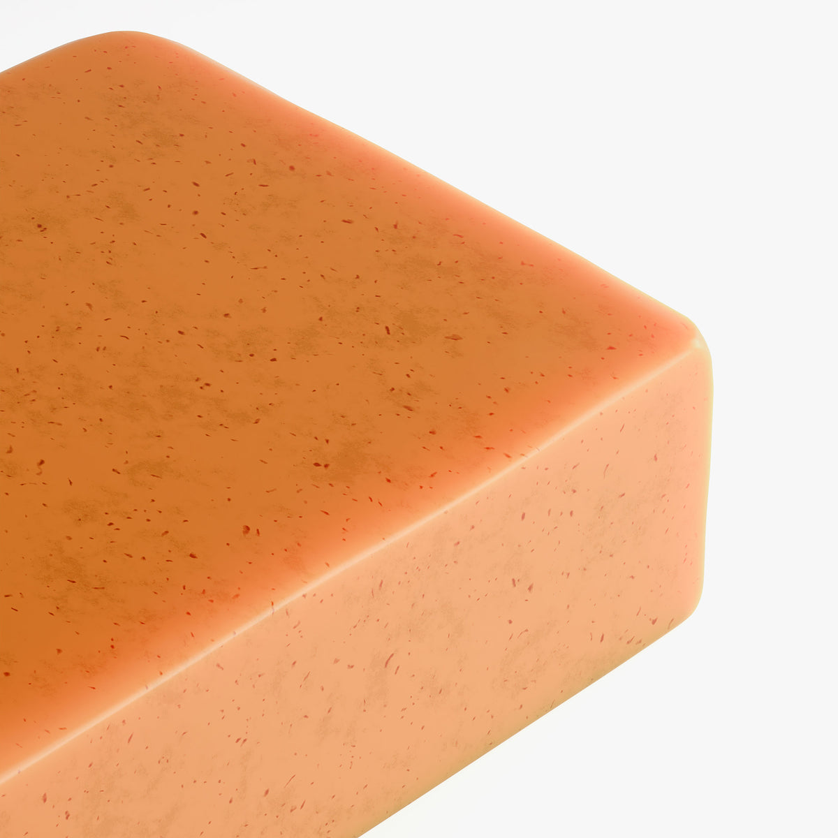 Close of of orange colored bar of soap corner edge