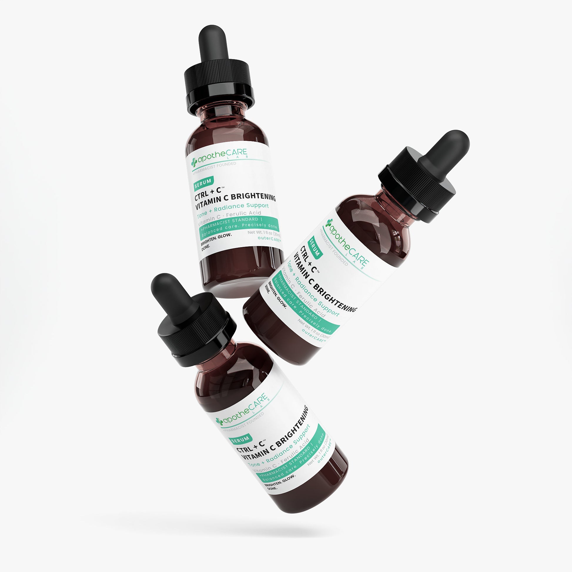 Three bottles of a skincare product with droppers on a white background