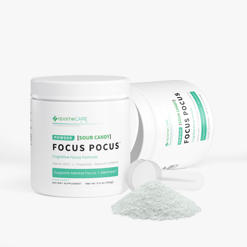 Two white plastic jars of apothecare Focus Pocus dietary supplement powder, one standing upright and one lying on its side, with a small pile of the pale mint-green powder in front on a clean white background.