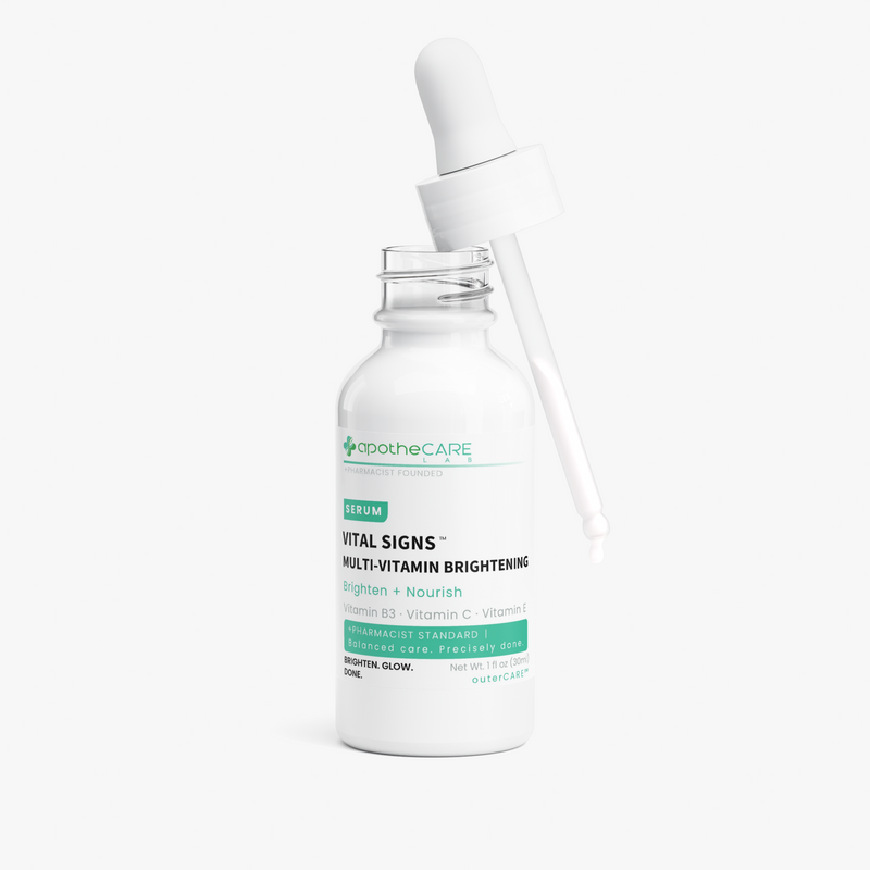 A white glass dropper bottle of apothecare serum with a white dropper resting on top, set against a clean white background.