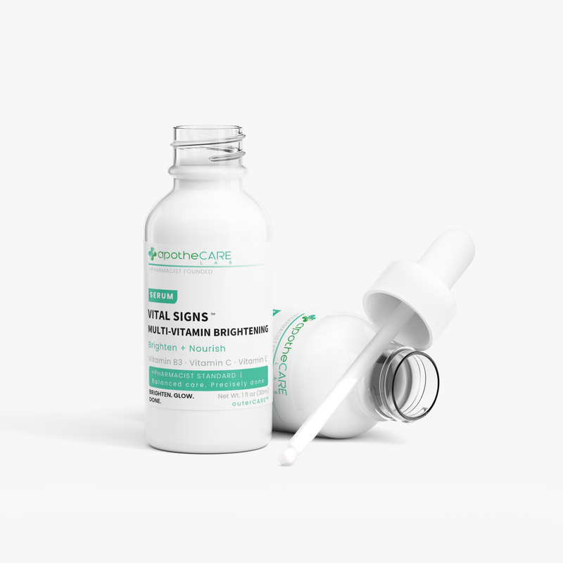 An ApotheCare Vital Signs multi-vitamin brightening serum bottle with a white dropper lying beside it on a clean white background.