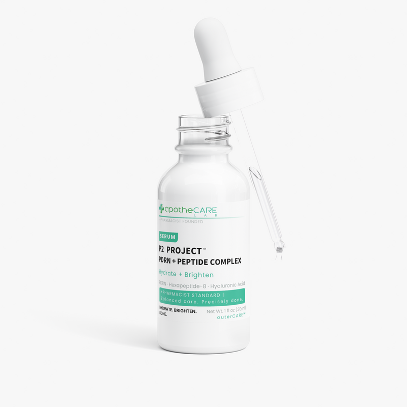 A white glass dropper bottle of apotheCARE P2 PROJECT serum with a clear glass pipette resting inside the open bottle, set against a clean white background.