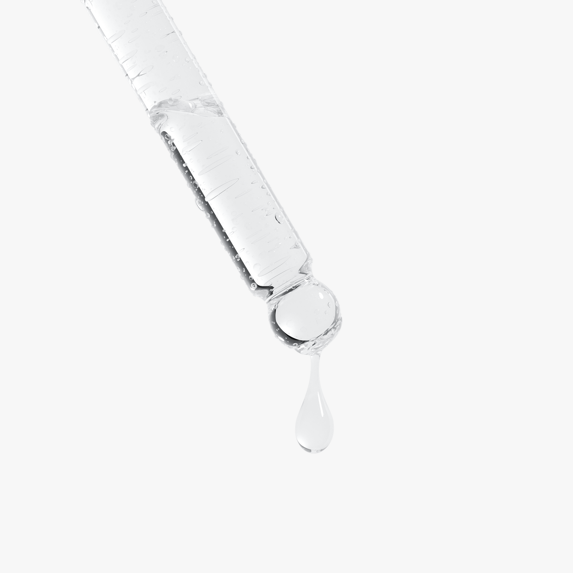 Glass dropper with clear liquid on a white background